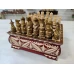 Шахматы резные ручной работы Богатыри в ларце 25 на 25 см